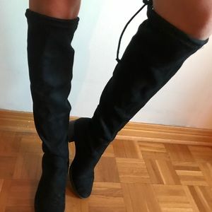 Black suede boots, knee height.